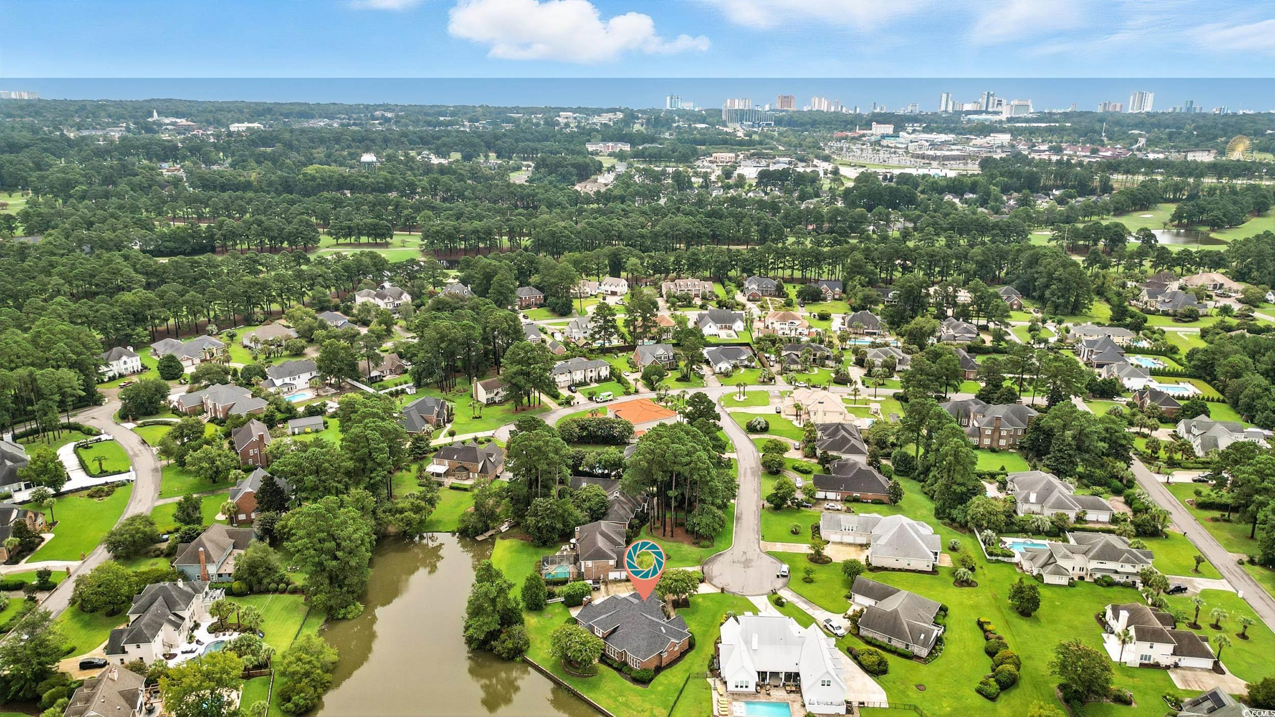 1473 Doar Point Myrtle Beach, SC 29577 - Photo 39 of 40 Aerial view of residential area with a nearby body of water and a tree filled landscape
