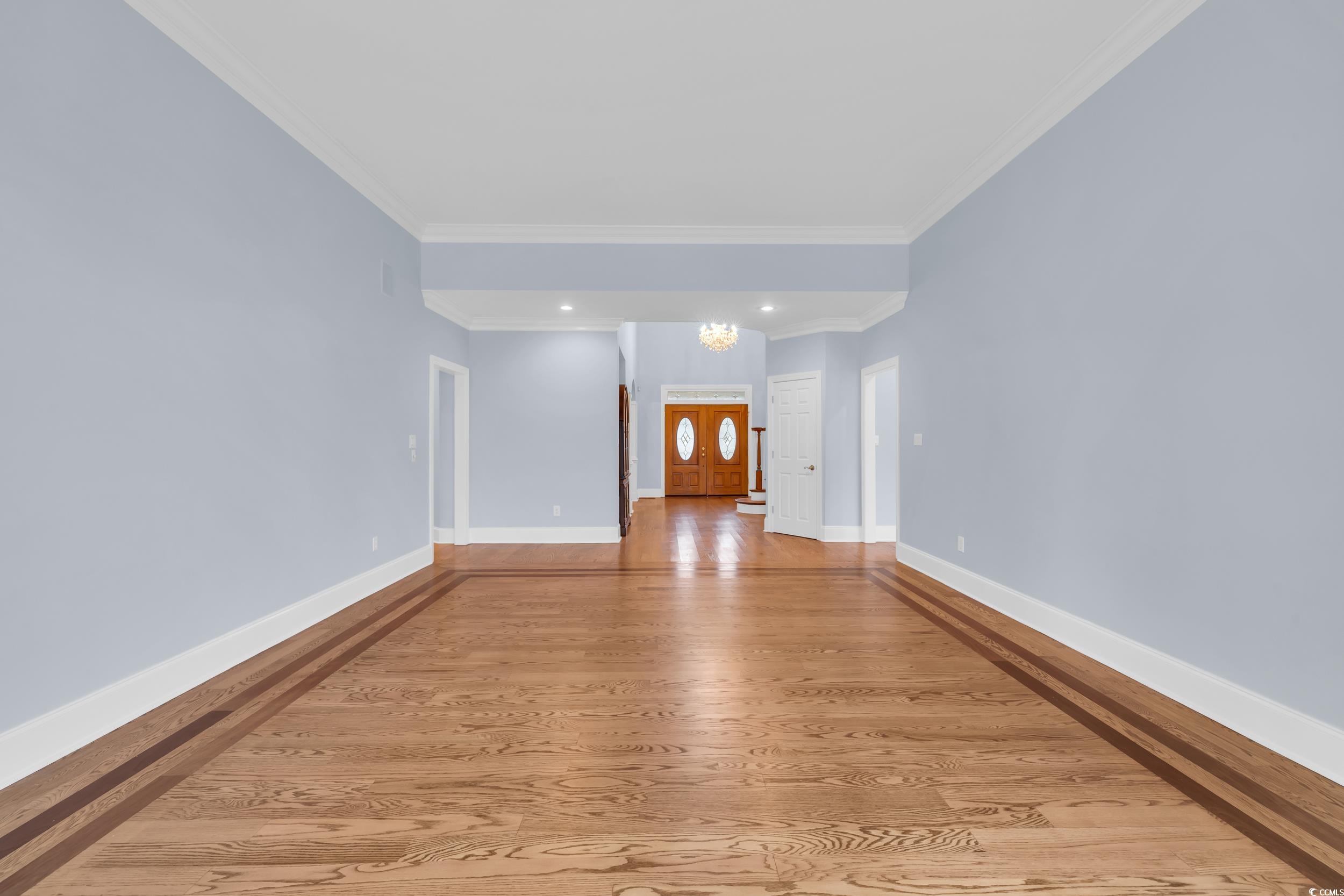 1473 Doar Point Myrtle Beach, SC 29577 - Photo 9 of 40 Hall with a chandelier, ornamental molding, light wood-style floors, and recessed lighting