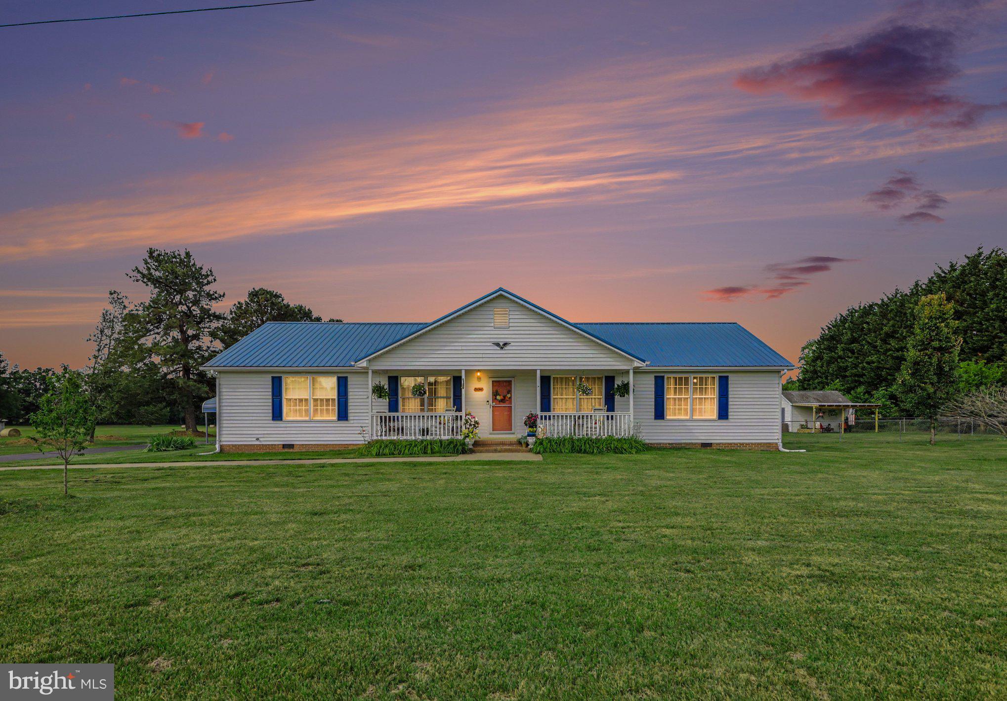 34340 Parker Road Locust Grove, VA 22508 - Photo 27 of 27 Charming home under a vibrant sunset.