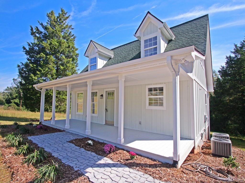 4924 Hudlow Road Union Mills, NC 28167 - Photo 1 of 34 a front view of a house with garden