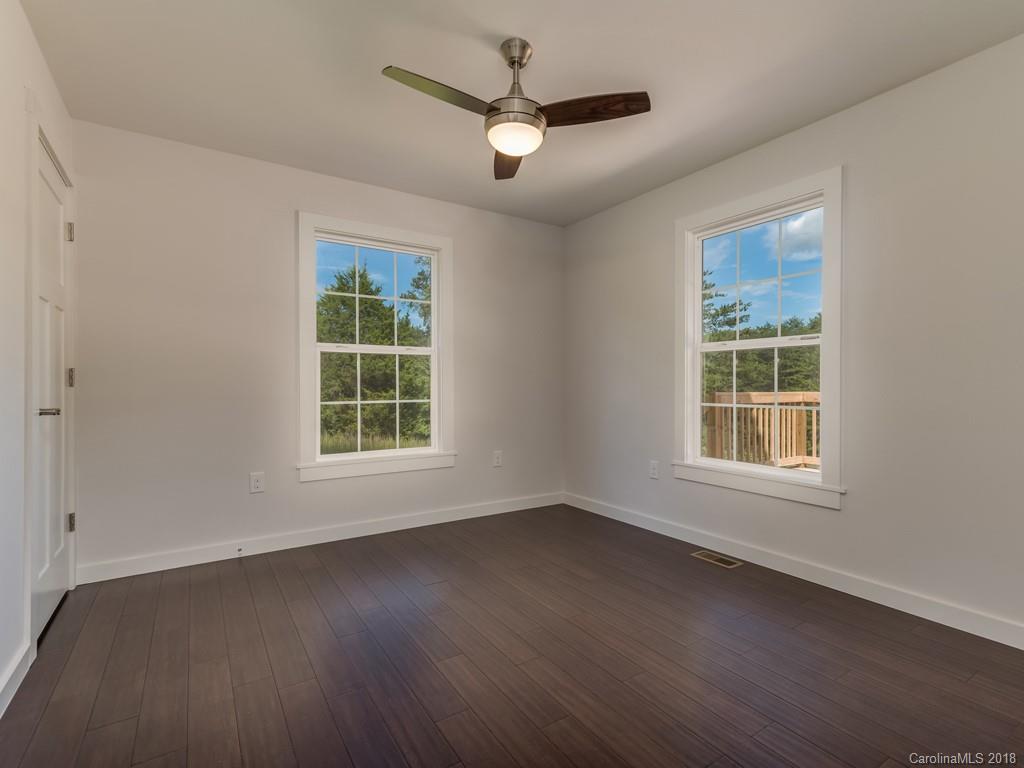 4924 Hudlow Road Union Mills, NC 28167 - Photo 12 of 34 a view of an empty room with wooden floor and a window