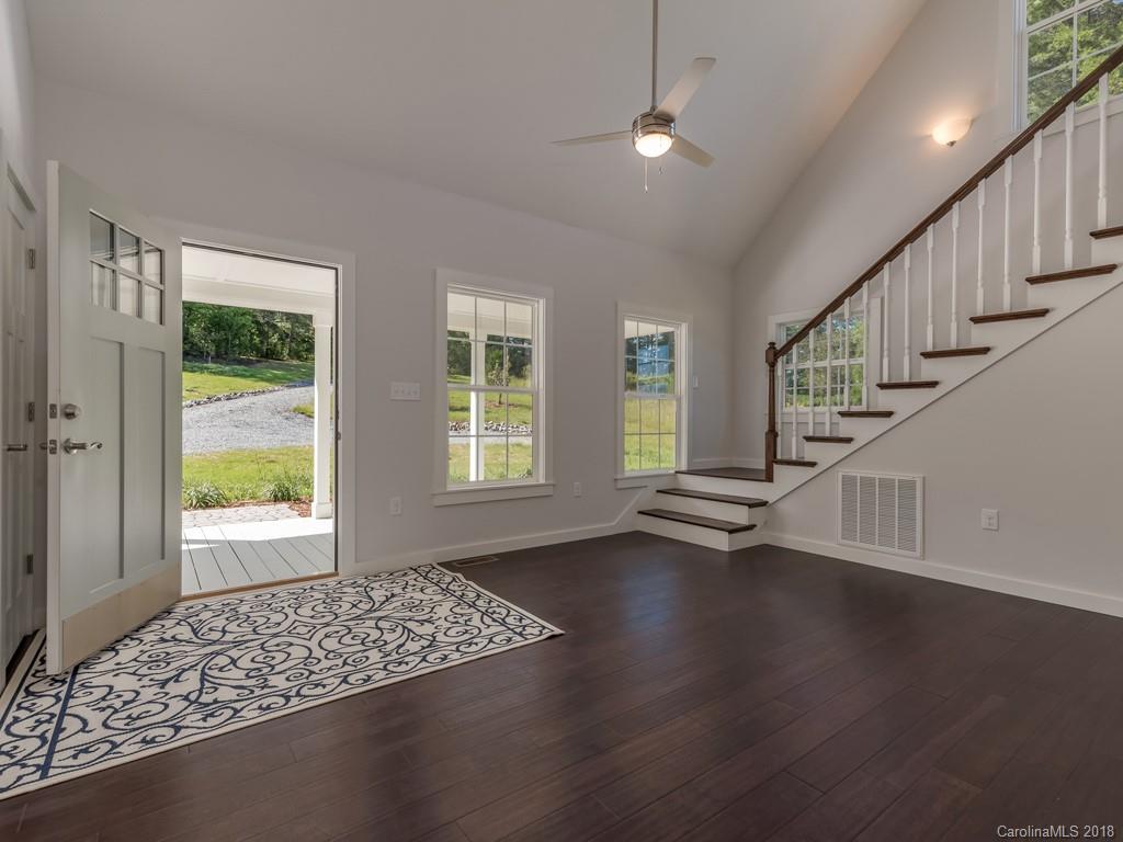 4924 Hudlow Road Union Mills, NC 28167 - Photo 4 of 34 a view of an empty room with wooden floor and a window