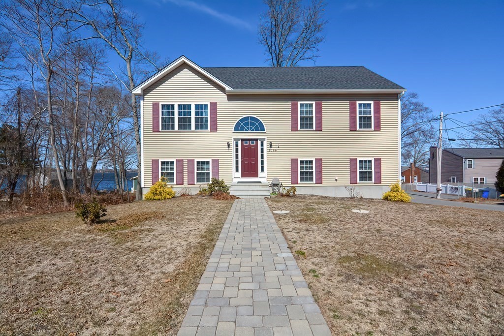 a front view of a house with a yard