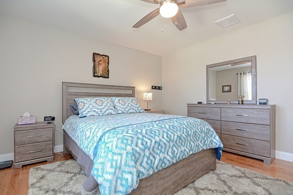 1066 Spencer Street Fall River, MA 02721 - Photo 13 of 35 a bedroom with a bed and a dresser