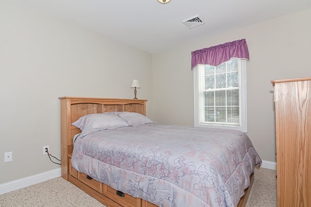 1066 Spencer Street Fall River, MA 02721 - Photo 16 of 35 a bedroom with a bed and a window