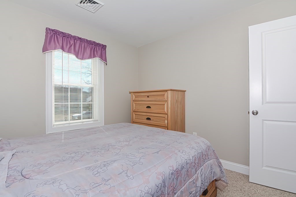 1066 Spencer Street Fall River, MA 02721 - Photo 17 of 35 a bedroom with a bed and a window