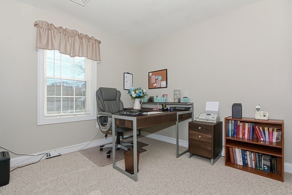 1066 Spencer Street Fall River, MA 02721 - Photo 25 of 35 a view of a workspace with furniture and a window