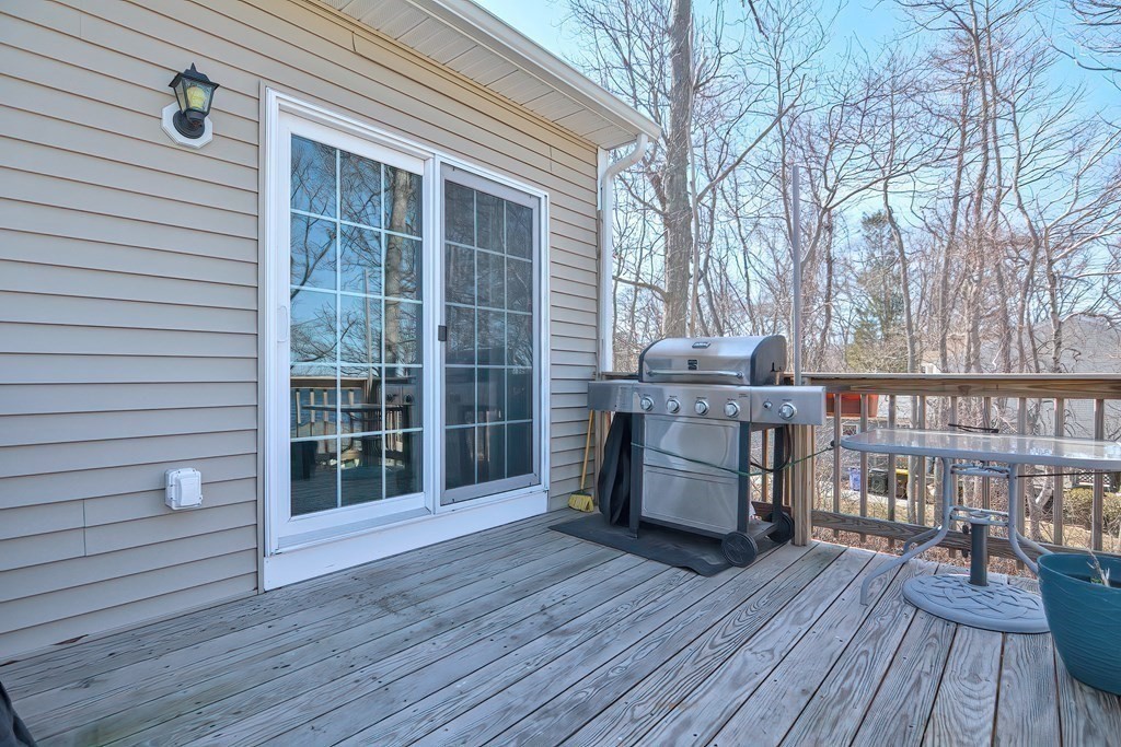 1066 Spencer Street Fall River, MA 02721 - Photo 28 of 35 a view of a deck with wooden floor and furniture