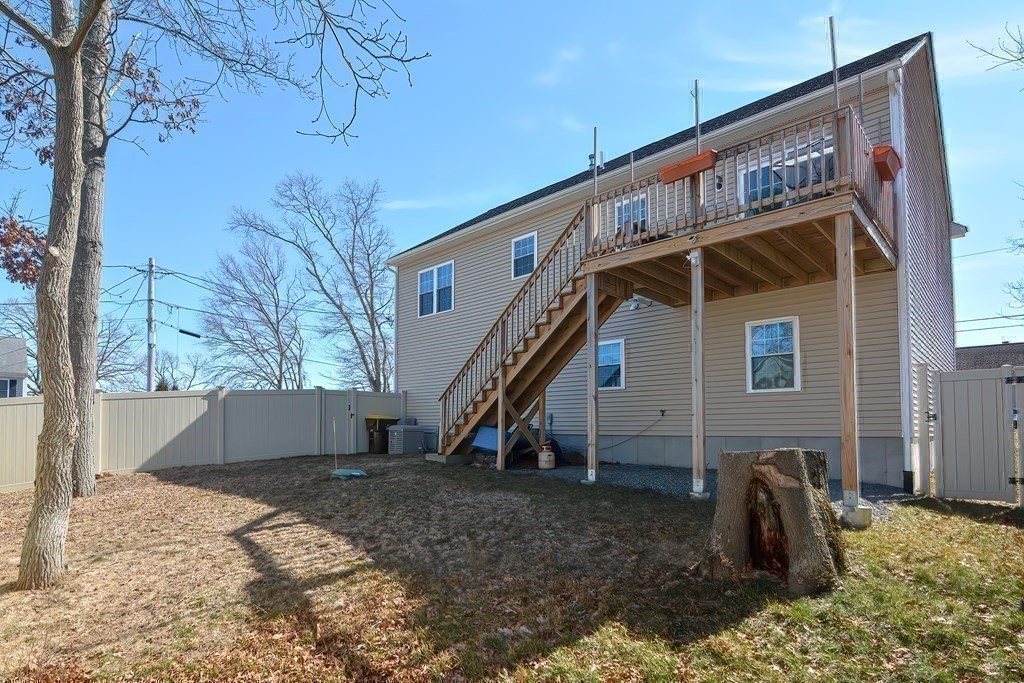 1066 Spencer Street Fall River, MA 02721 - Photo 34 of 35 a view of a house with a yard
