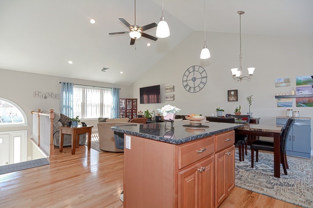 1066 Spencer Street Fall River, MA 02721 - Photo 8 of 35 a kitchen with lots of counter space and dining table