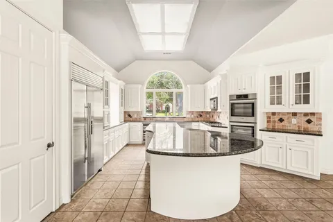 a kitchen with a window a sink and a window