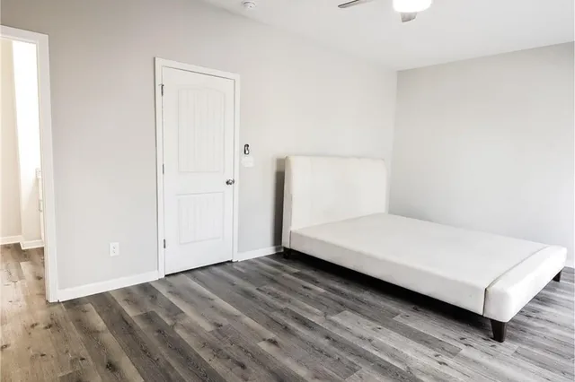 a room with a bed and a night stand