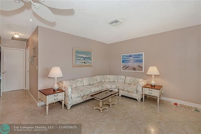 a bedroom with a bed and a lamp on desk