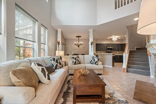 a front view of a house with a yard and trees