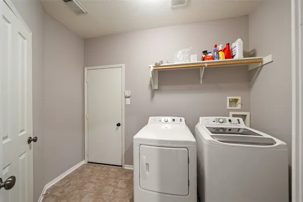 a bathroom with a granite countertop sink toilet and a mirror