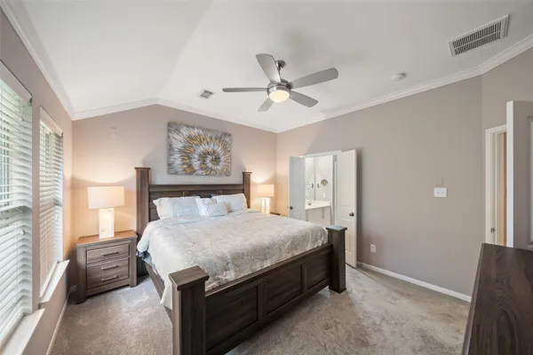 a kitchen that has a lot of cabinets in it and wooden floors