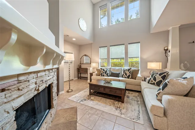 a living room with furniture and a fireplace