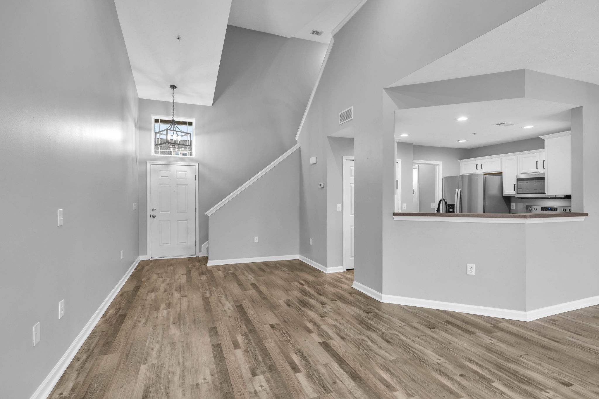 2008 Lavender Court Spring Hill, TN 37174 - Photo 14 of 51 a view of a hallway with wooden floor and staircase