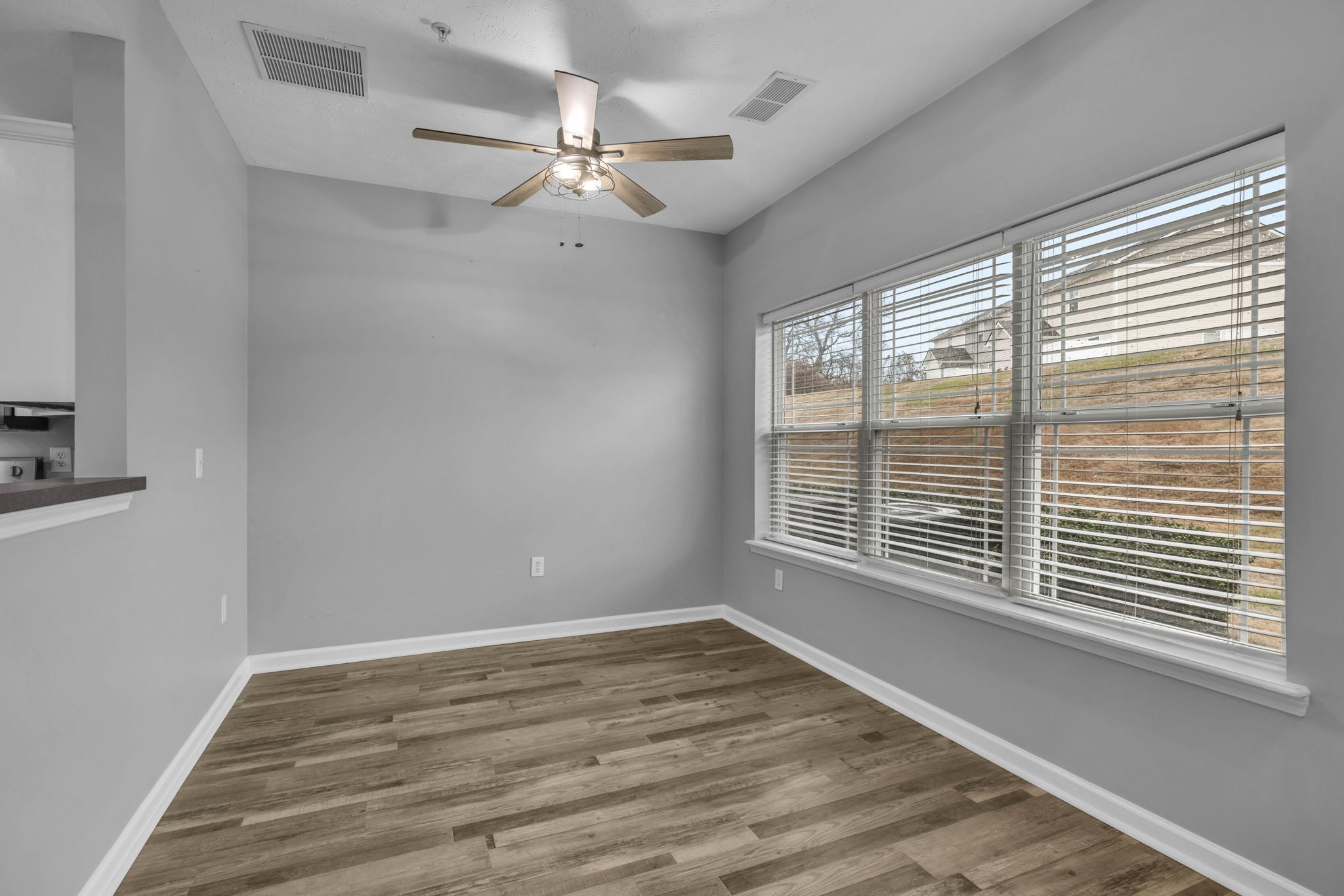 2008 Lavender Court Spring Hill, TN 37174 - Photo 18 of 51 a view of an empty room with wooden floor and a window