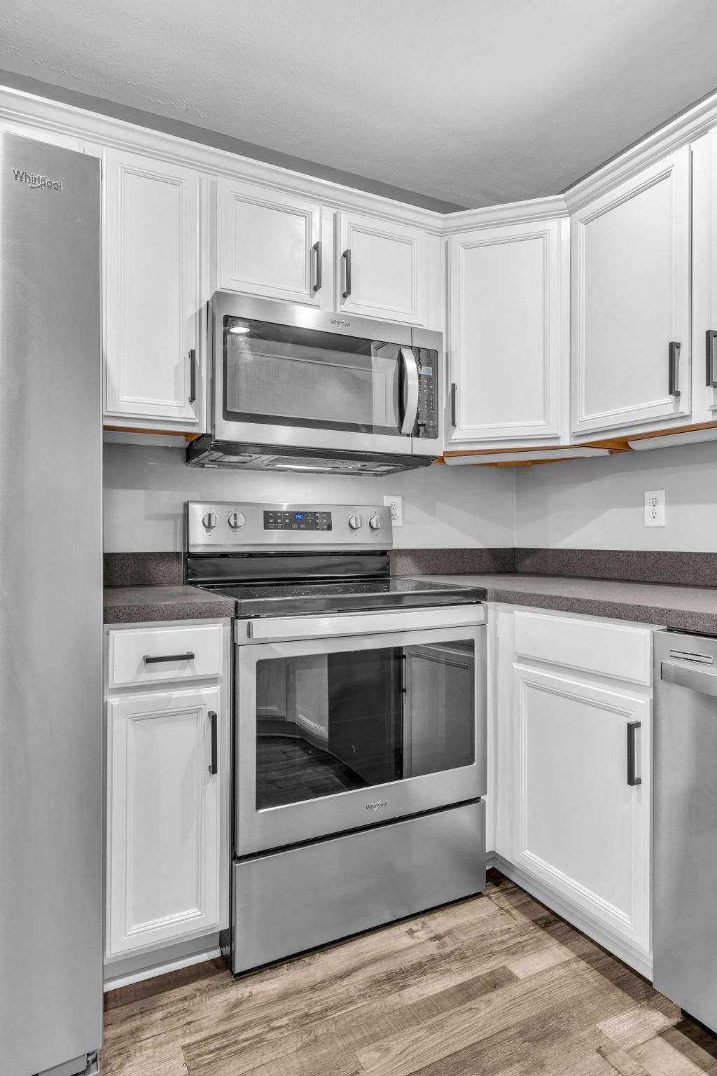2008 Lavender Court Spring Hill, TN 37174 - Photo 26 of 51 a kitchen with white cabinets and stainless steel appliances