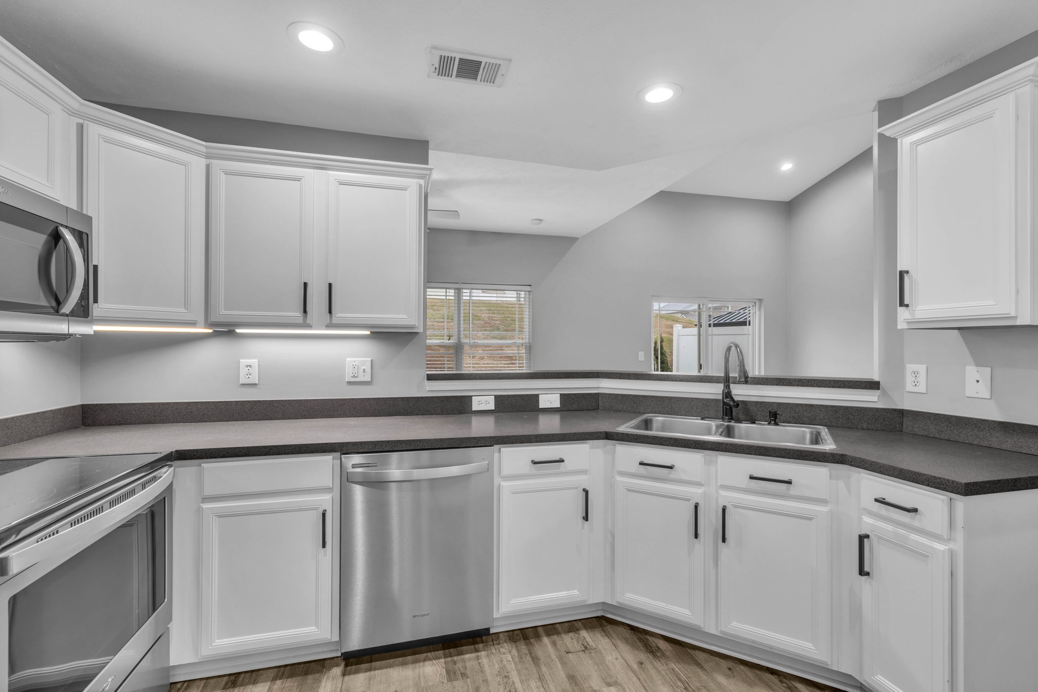 2008 Lavender Court Spring Hill, TN 37174 - Photo 28 of 51 a white kitchen with granite countertop white cabinets and a sink