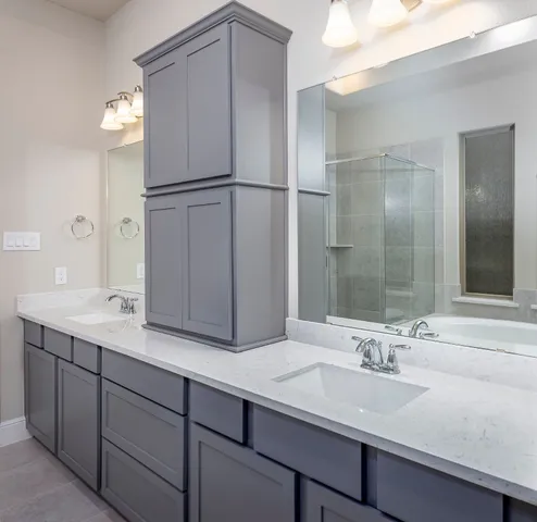 a bathroom with a double vanity sink and mirror