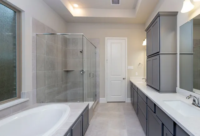 a bathroom with a bathtub and a sink