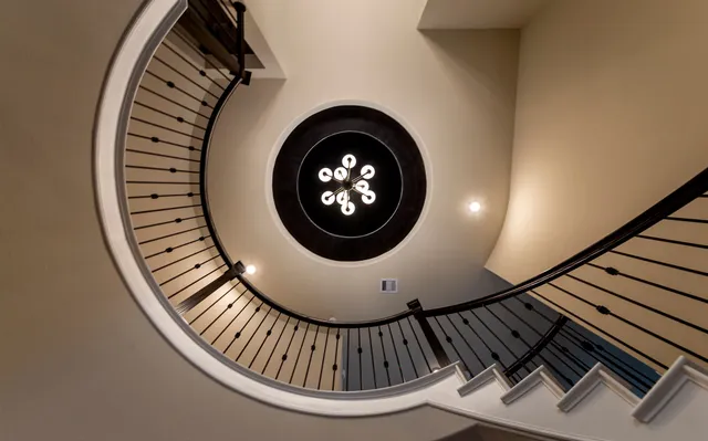 a view of entryway wooden floor and a chandelier