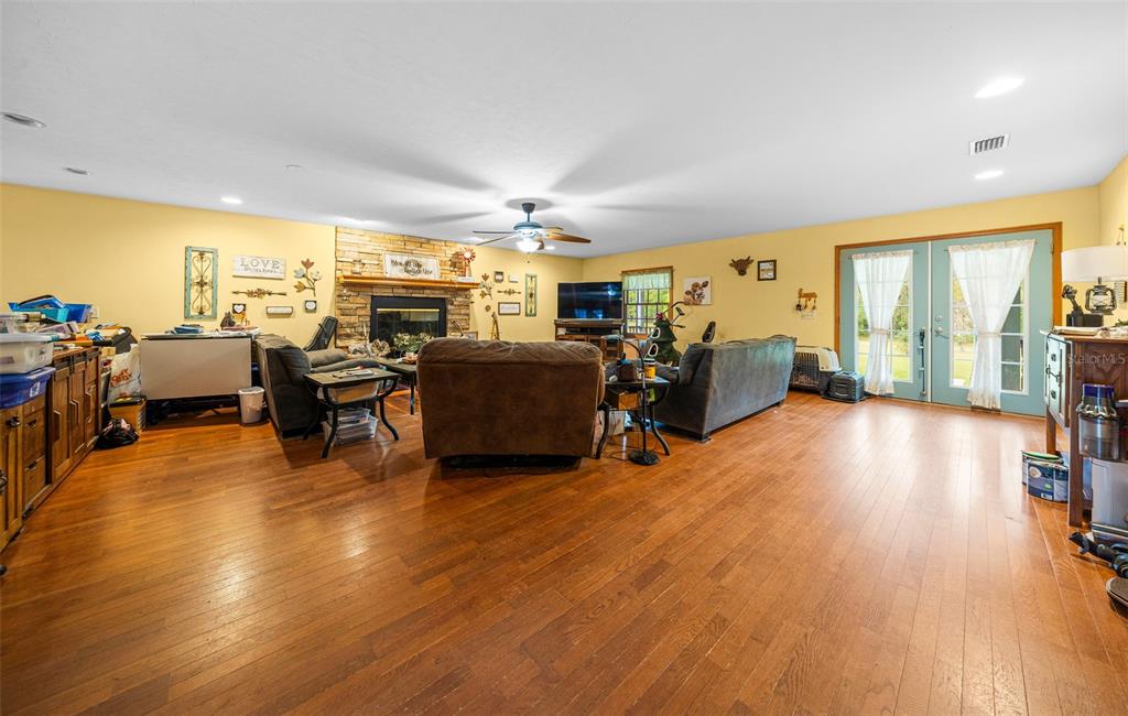 732 Carl Wilson Road Fort White, FL 32038 - Photo 12 of 80 a living room with furniture and a wooden floor