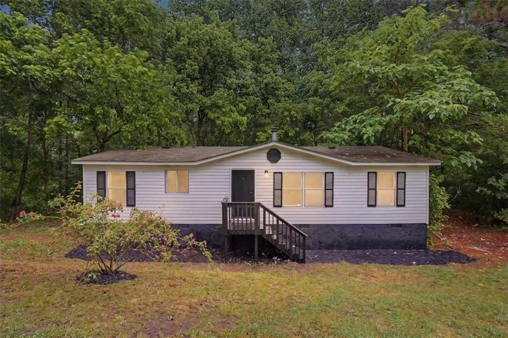 360 Black Knob Church Road Ranger, GA 30734 - Photo 20 of 20 a view of a house with a yard and a large tree