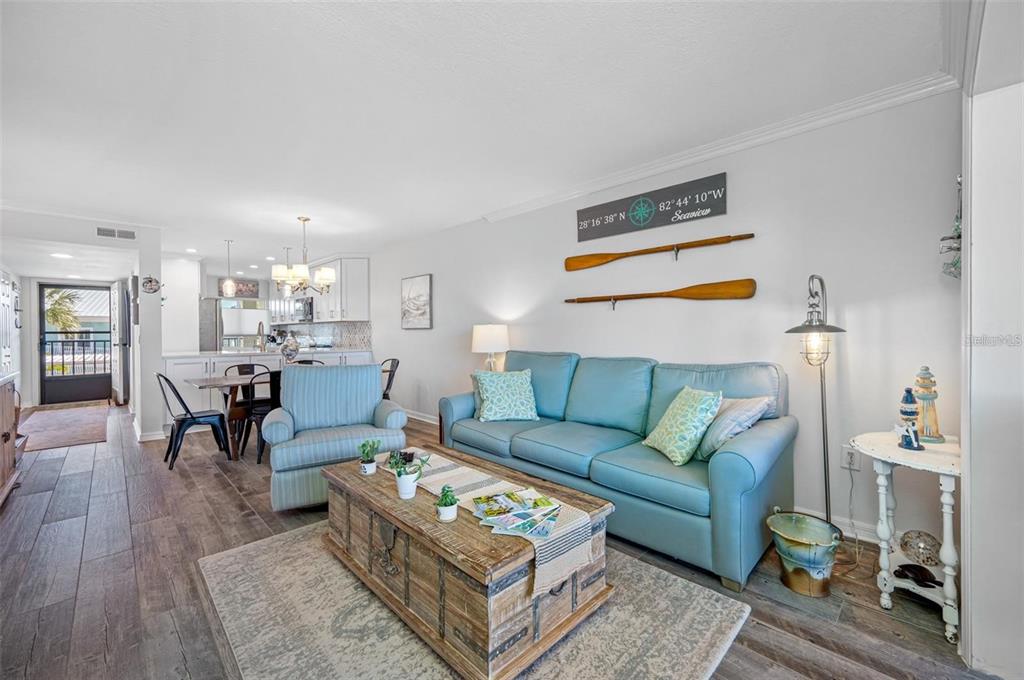 8251 Brent Street, Unit 912 Port Richey, FL 34668 - Photo 12 of 84 a living room with furniture and wooden floor