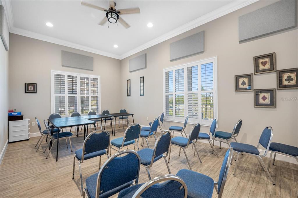 8251 Brent Street, Unit 912 Port Richey, FL 34668 - Photo 39 of 84 a view of a dining room with furniture window and wooden floor