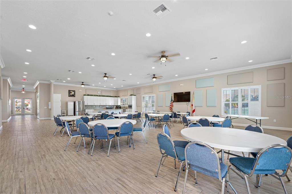 8251 Brent Street, Unit 912 Port Richey, FL 34668 - Photo 41 of 84 a view of a dining room with furniture window and wooden floor