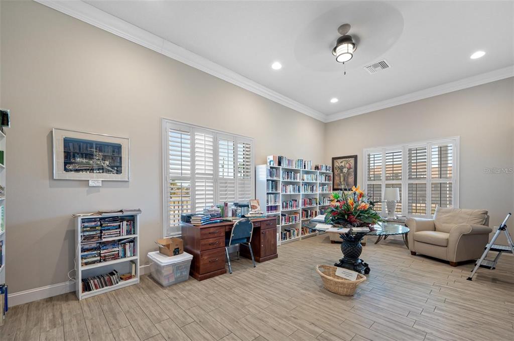 8251 Brent Street, Unit 912 Port Richey, FL 34668 - Photo 42 of 84 a living room with furniture or couch and a wooden floor