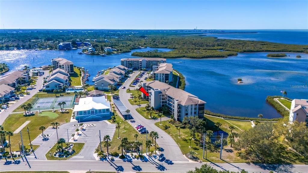8251 Brent Street, Unit 912 Port Richey, FL 34668 - Photo 47 of 84 an aerial view of a houses with a lake view