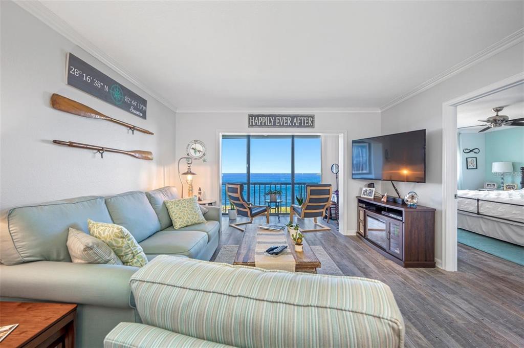 8251 Brent Street, Unit 912 Port Richey, FL 34668 - Photo 5 of 84 a living room with furniture and a flat screen tv