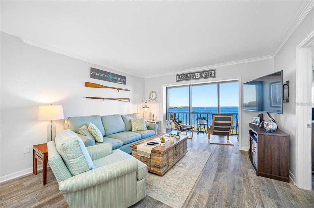 8251 Brent Street, Unit 912 Port Richey, FL 34668 - Photo 6 of 84 a living room with furniture and a wooden floor