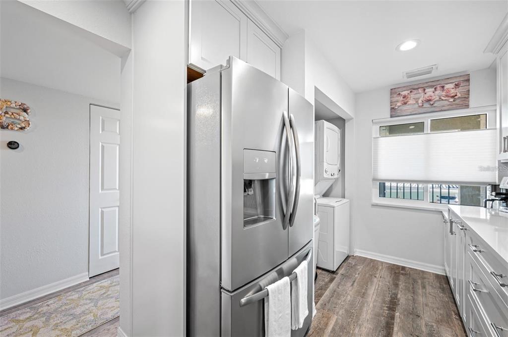 8251 Brent Street, Unit 912 Port Richey, FL 34668 - Photo 78 of 84 a kitchen with stainless steel appliances granite countertop a refrigerator and a stove top oven