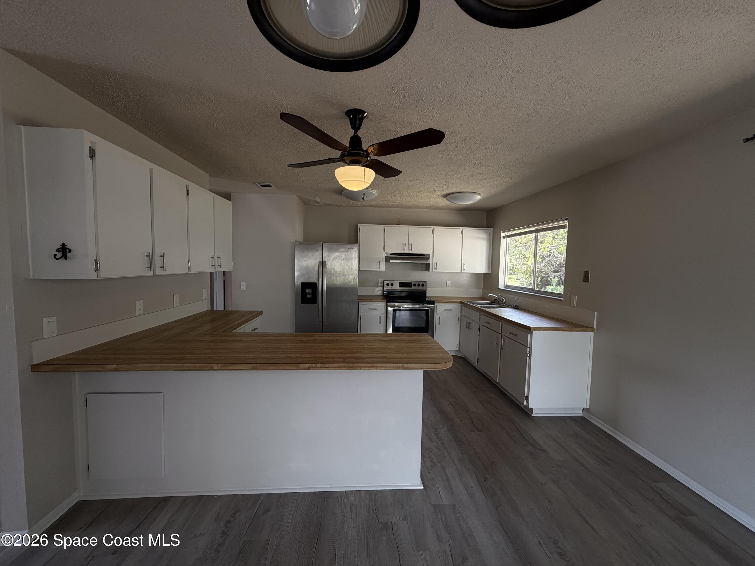 1256 Dawn Street Northeast Palm Bay, FL 32905 - Photo 5 of 19 IMG_1889