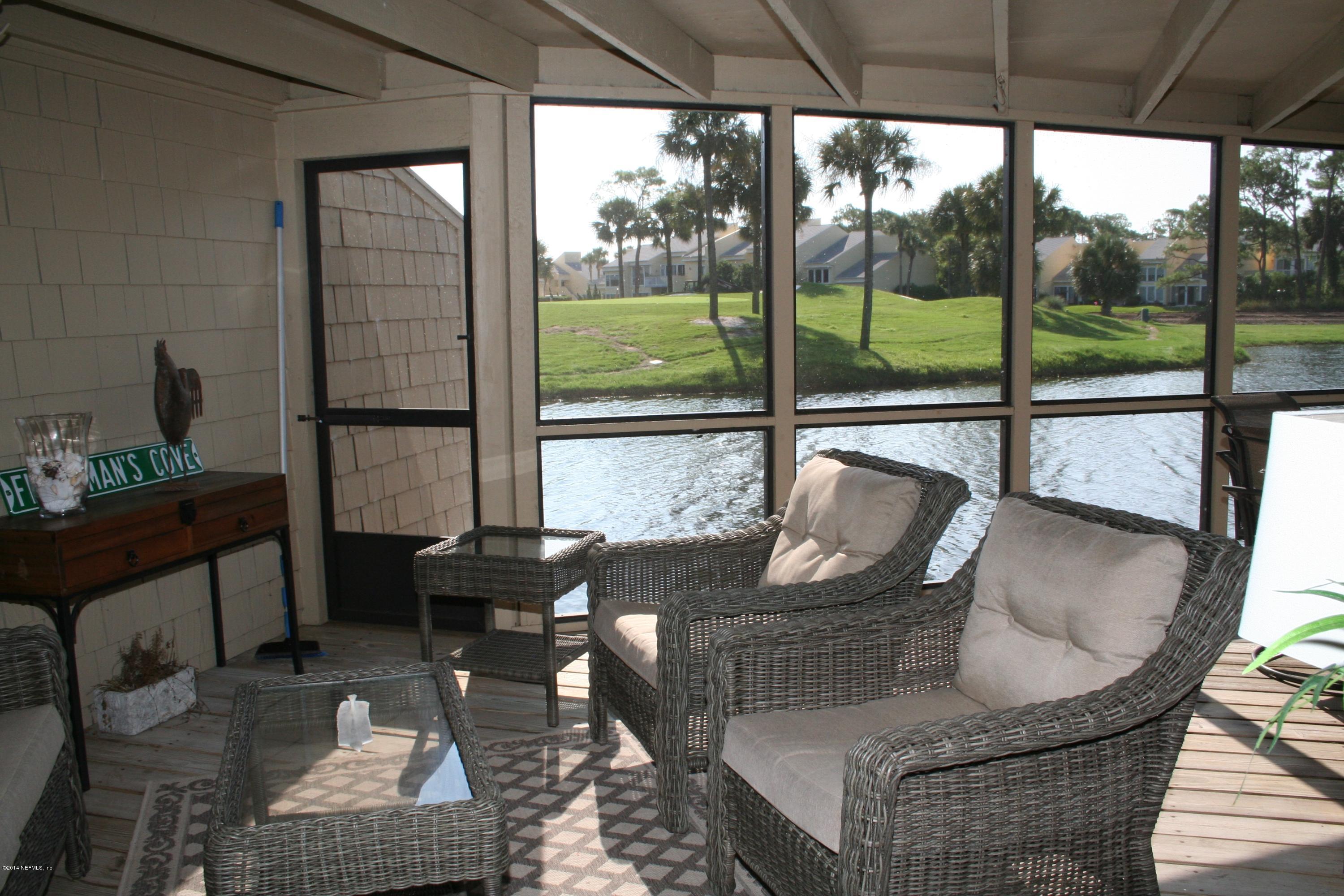 Screen patio ovelooking the water