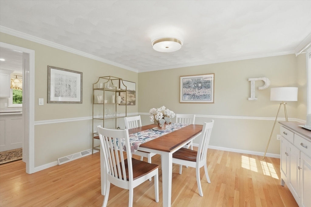 9 Fazio Farm Road Georgetown, MA 01833 - Photo 15 of 42 a view of a dining room with furniture and wooden floor