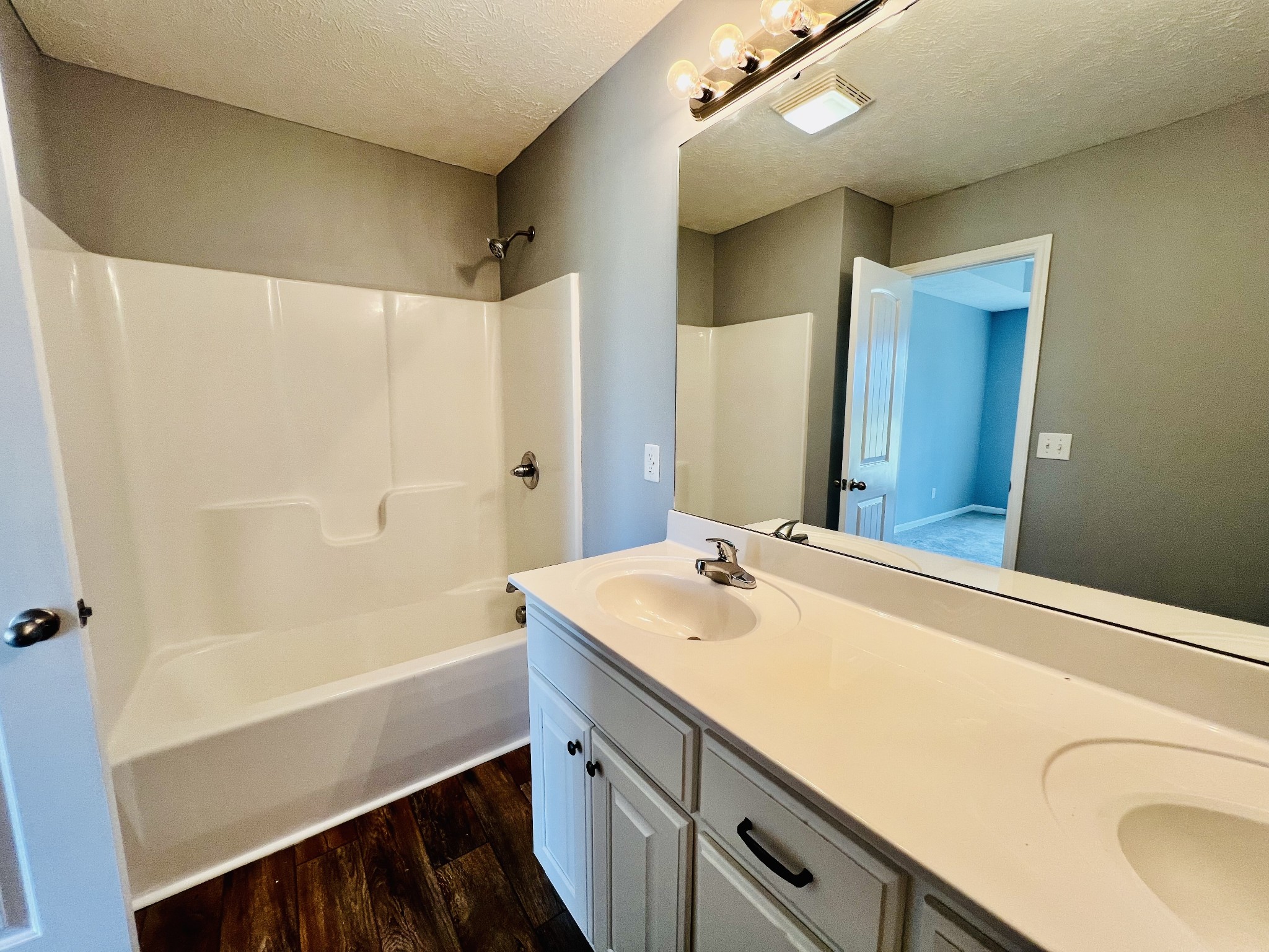 4560 Fall River Road Pulaski, TN 38478 - Photo 14 of 28 a bathroom with a sink a vanity and a mirror
