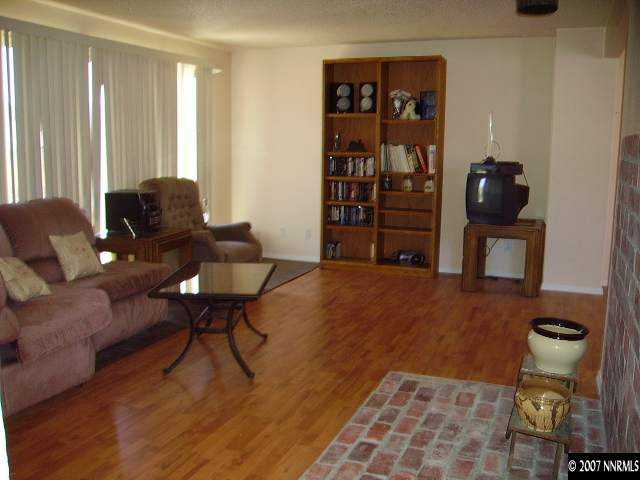 3465 Becard Lane Reno, NV 89508 - Photo 1 of 9 a living room with furniture and wooden floor