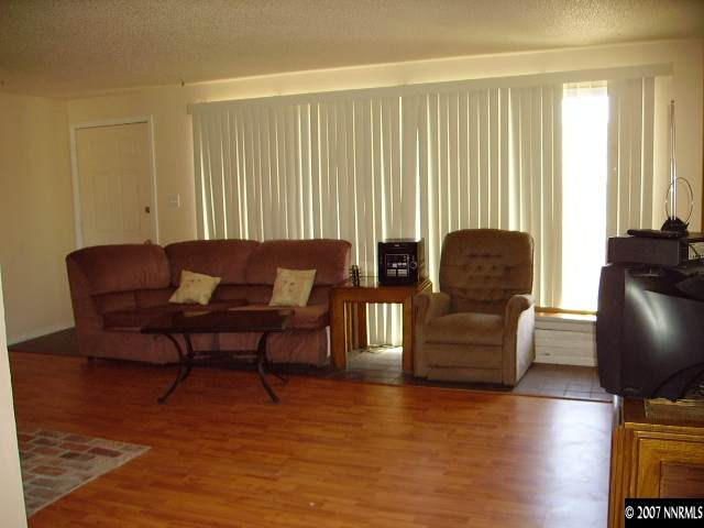 3465 Becard Lane Reno, NV 89508 - Photo 3 of 9 a living room with furniture and a wooden floor