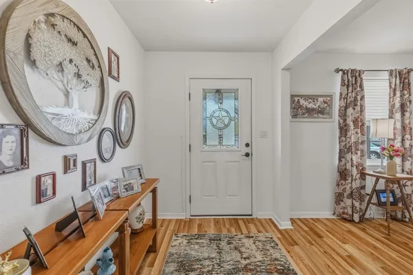 a view of a livingroom with furniture and window