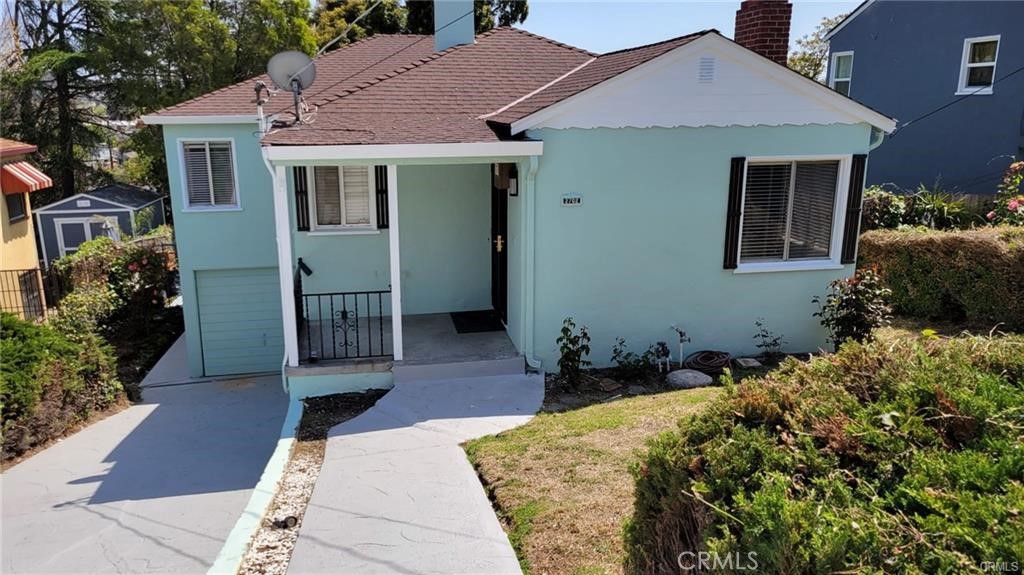 a backyard of a house with wooden floor yard and outdoor seating