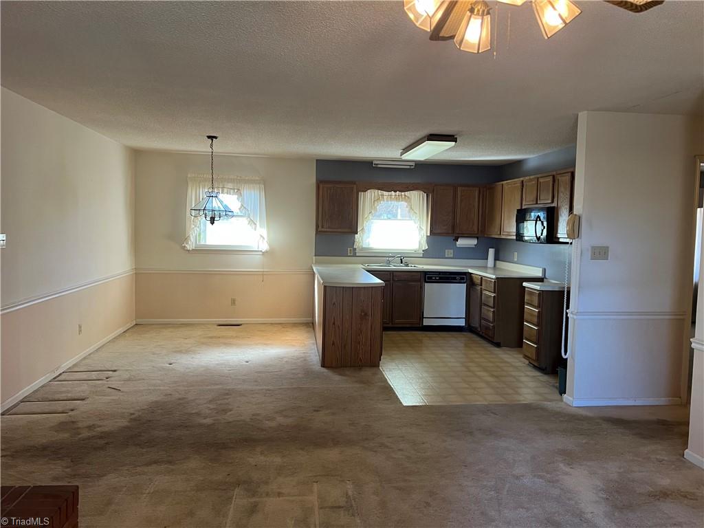 797 Sedge Garden Road Kernersville, NC 27284 - Photo 13 of 24 From den to kitchen