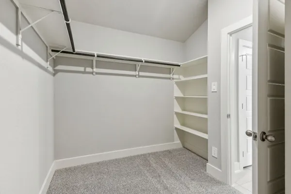 a view of an empty walk in closet