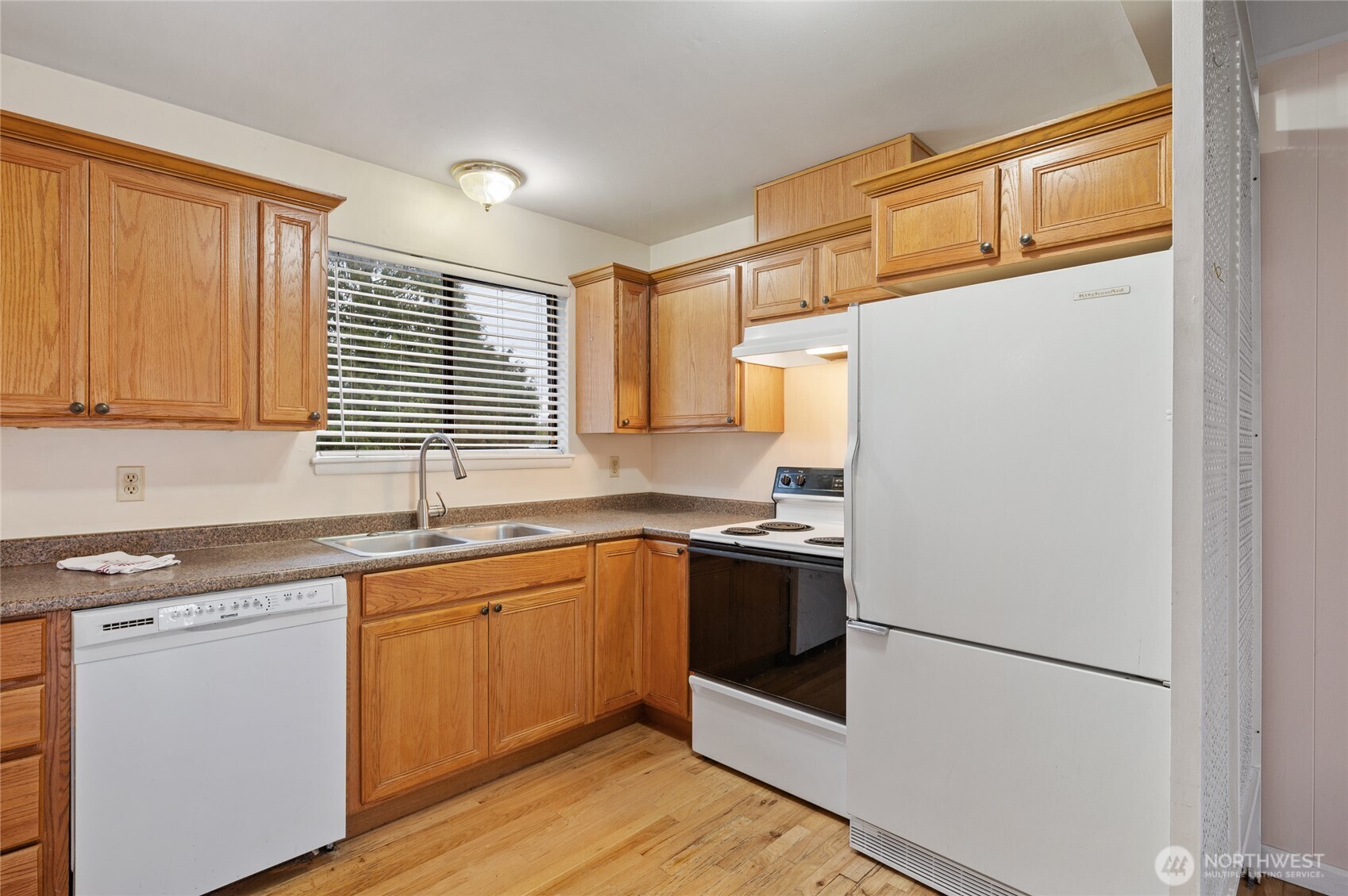 2014 Southwest 152nd Street Burien, WA 98166 - Photo 12 of 21 a kitchen with stainless steel appliances granite countertop a refrigerator sink and stove