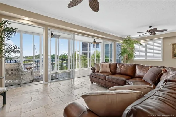 a view of a livingroom with furniture and a potted plant